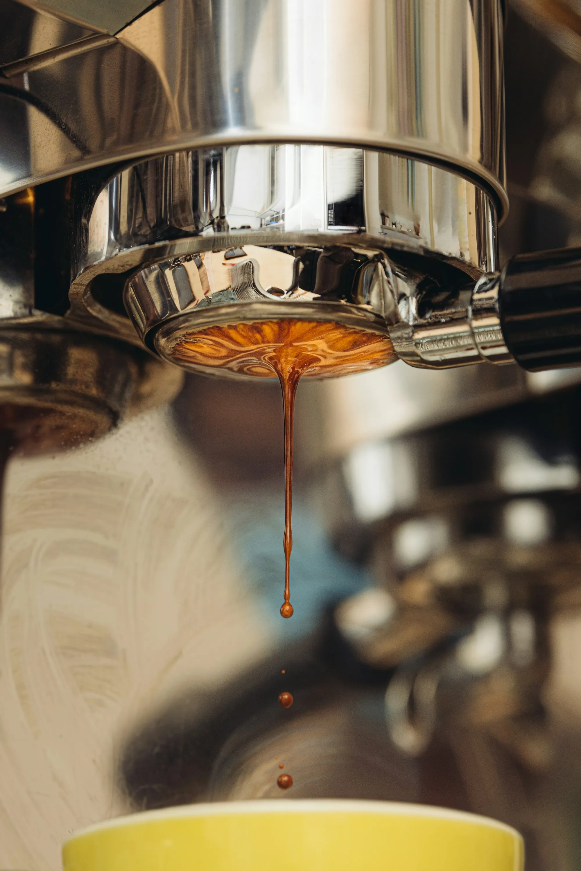 Espresso machine pulling a shot in a cafe