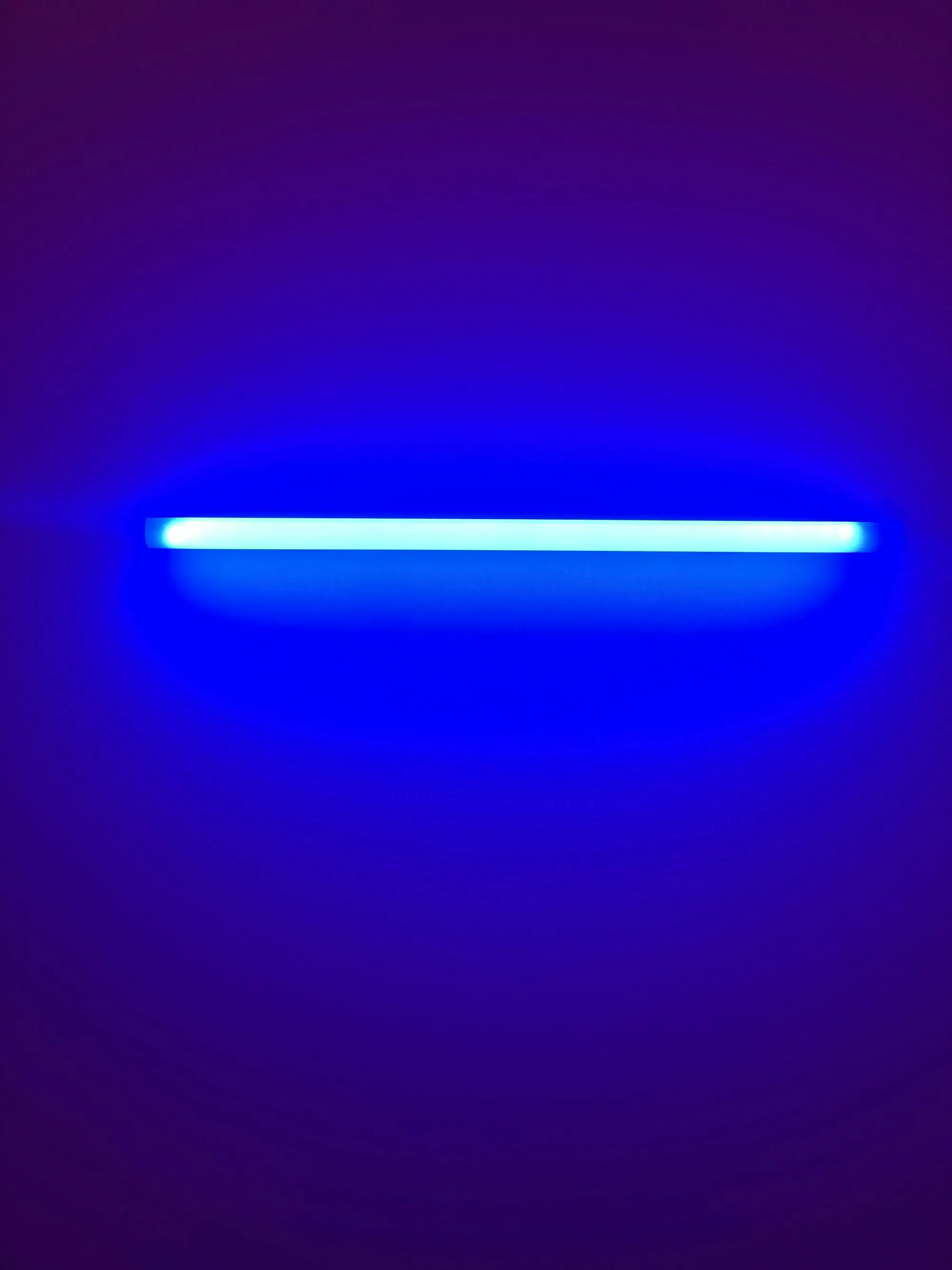 Blue ultraviolet light glowing in the dark